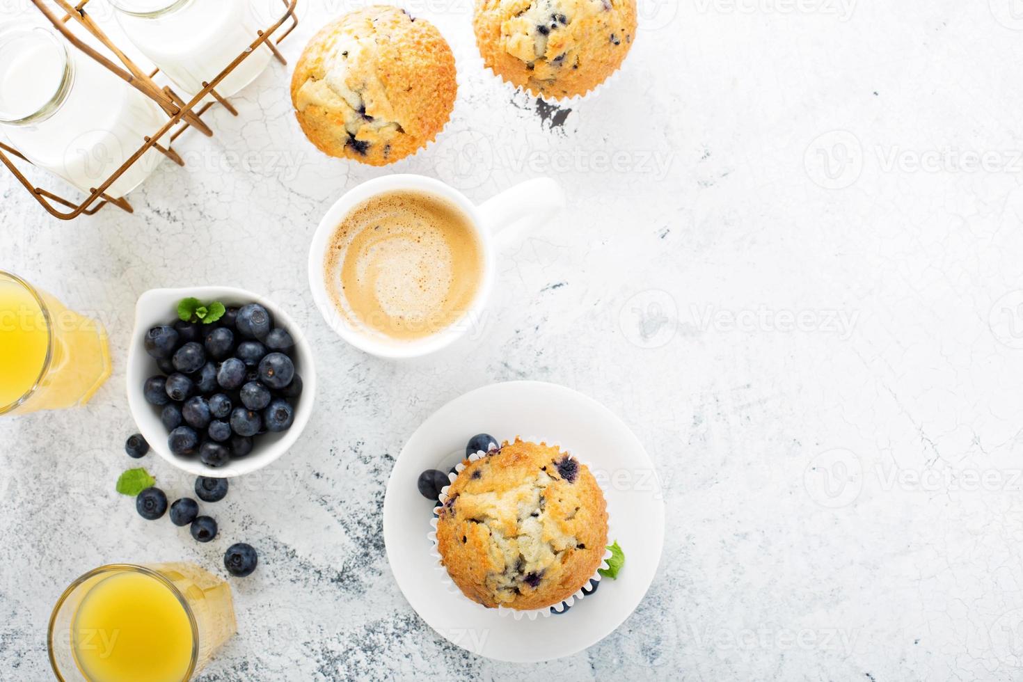 Bright and airy breakfast with blueberry muffin photo