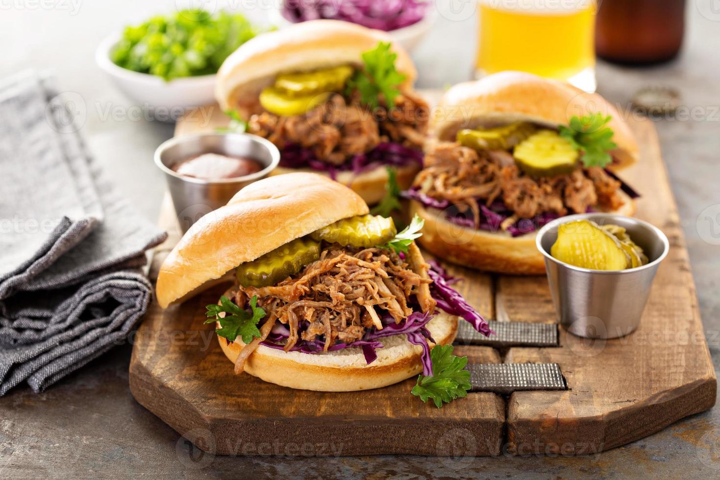 Pulled pork sandwiches with cabbage and pickles photo