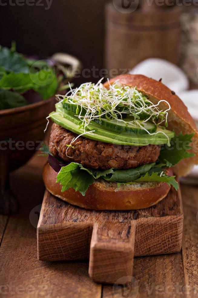 Grilled vegan bean burger with greens photo