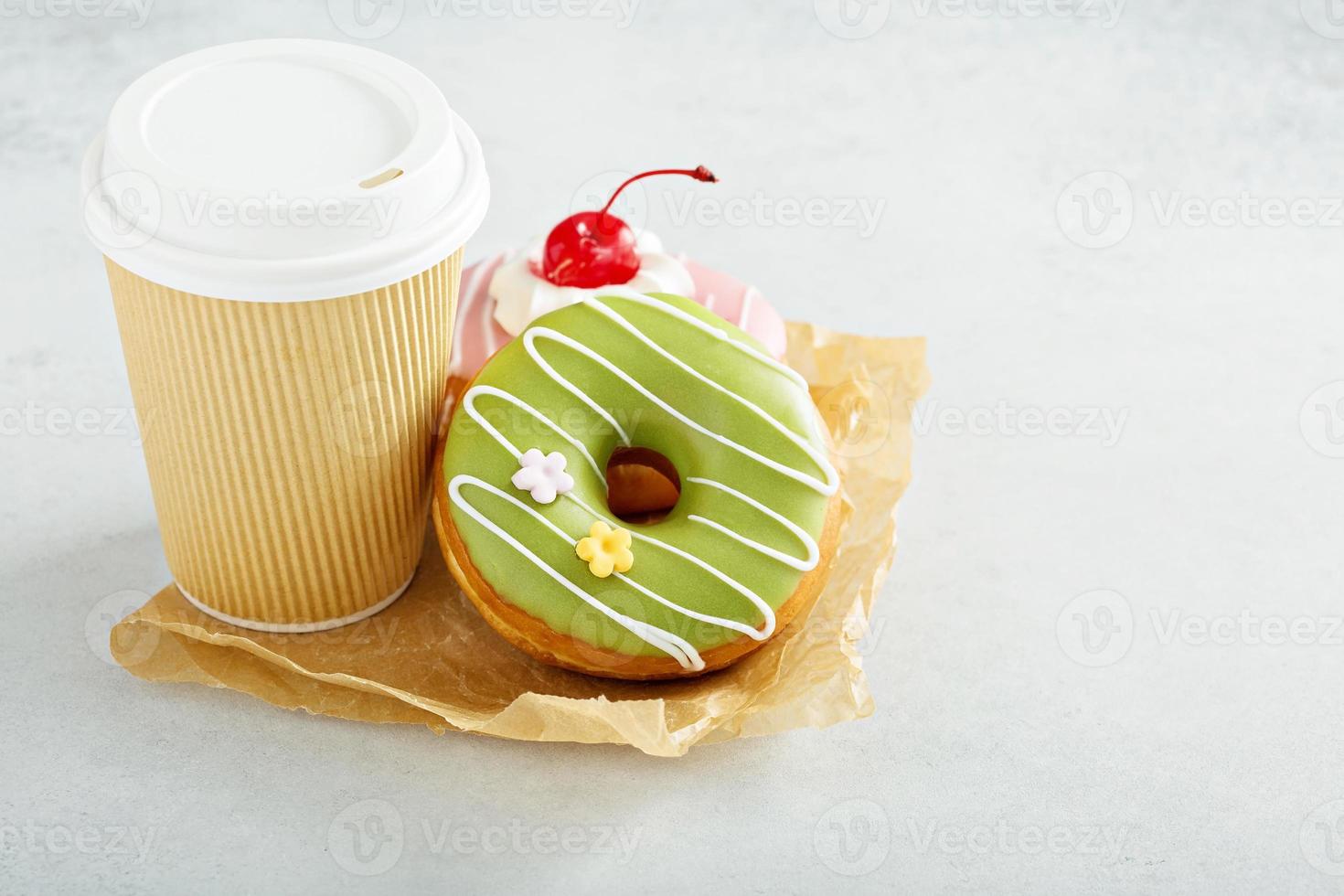 Two glazed donuts with coffee photo