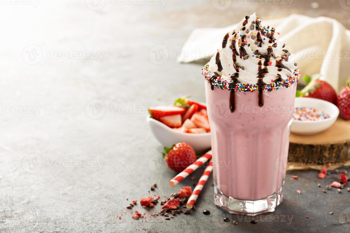 Strawberry milkshake with whipped cream photo