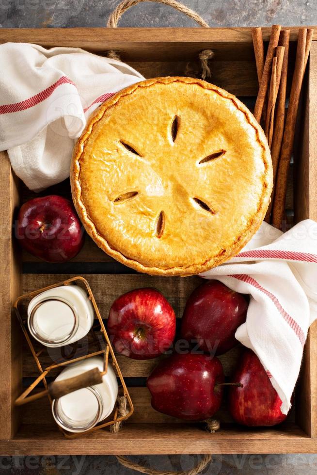 Apple pie in a wooden crate photo