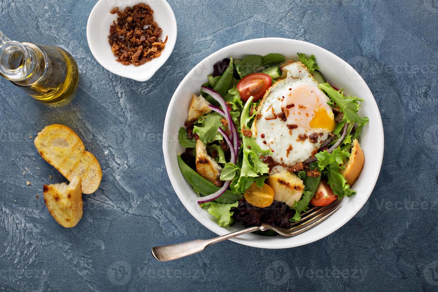 Breakfast salad with eggs and bacon photo