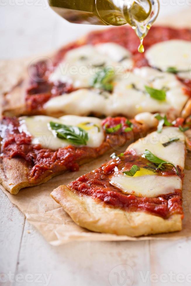 Grilled Margherita pizza with tomato sauce and mozzarella photo