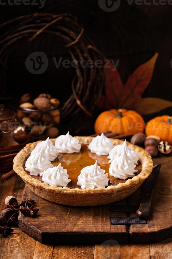 Pumpkin pie with whipped cream photo