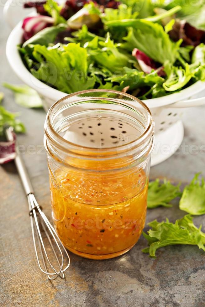 Italian vinaigrette dressing in a mason jar photo