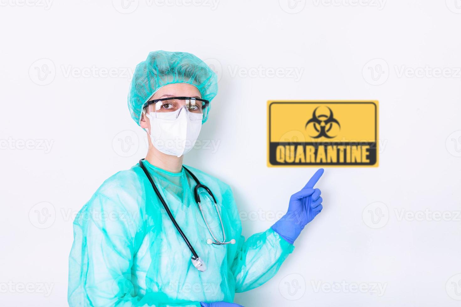 Portrait of doctor, nurse in protective clothes during coronavirus pandemic next to quarantine sign. Epidemic, pandemic of coronavirus covid 19. Doctor, patient in respirator. photo