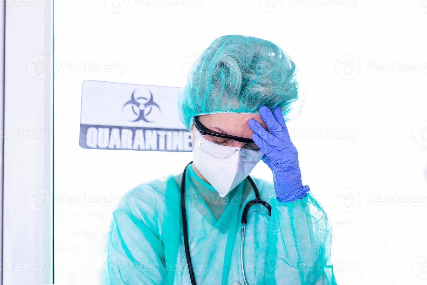 Coronavirus pandemic . Tired exhausted doctor, nurse after long shift fighting against Coronavirus 2019-nCoV at hospital clinic. Global pandemic outbreak SARS-CoV-2 worldwide virus. photo