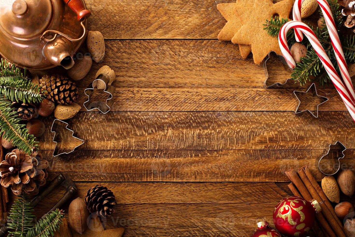 Christmas background with nuts, spices and pine tree photo