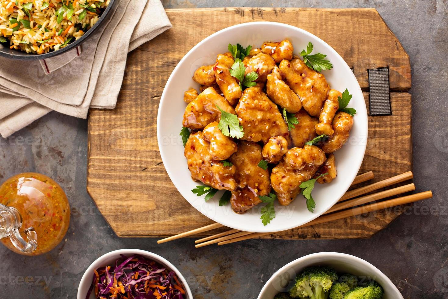 Spicy sweet and sour chicken with rice and cabbage photo