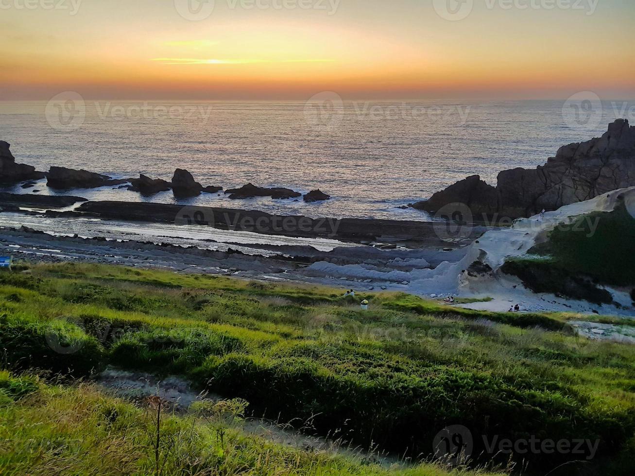 Sunset over the ocean photo