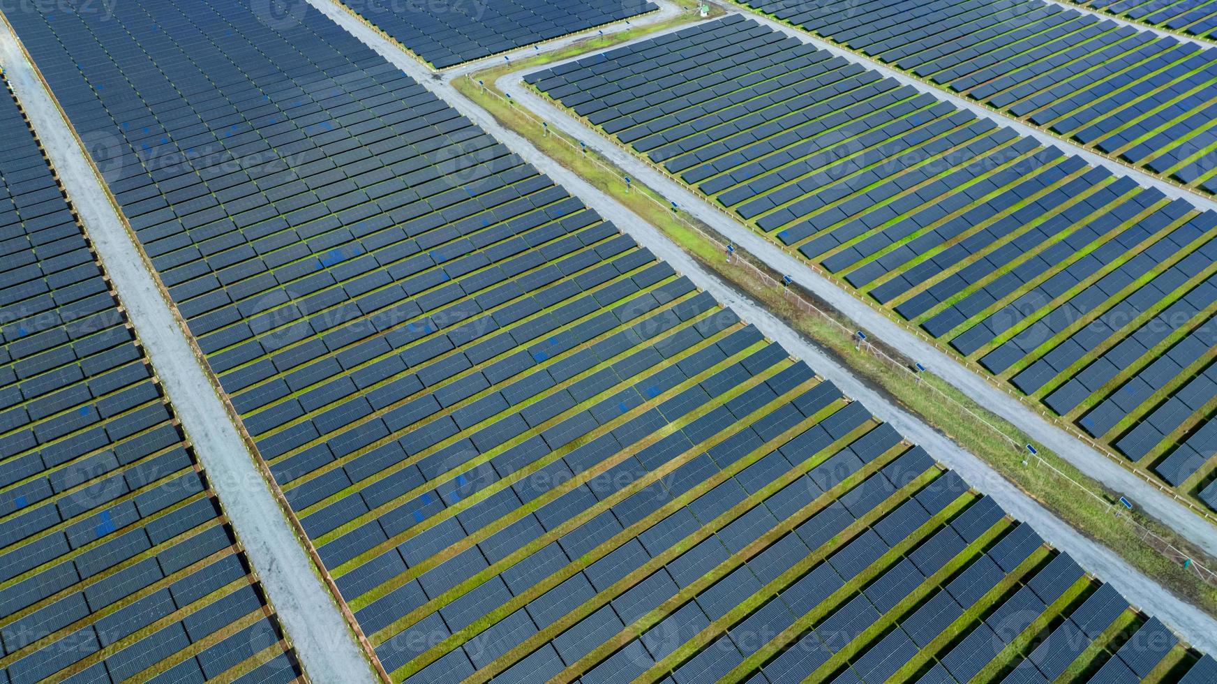 Aerial view of solar farm. Solar power for green energy. Sustainable resources. Solar cell panels use sun light as a source to generate electricity. Photovoltaics or PV. Sustainable renewable energy. photo