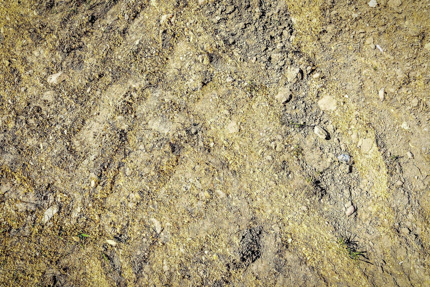 Detailed close up view on a brown sand ground texture photo