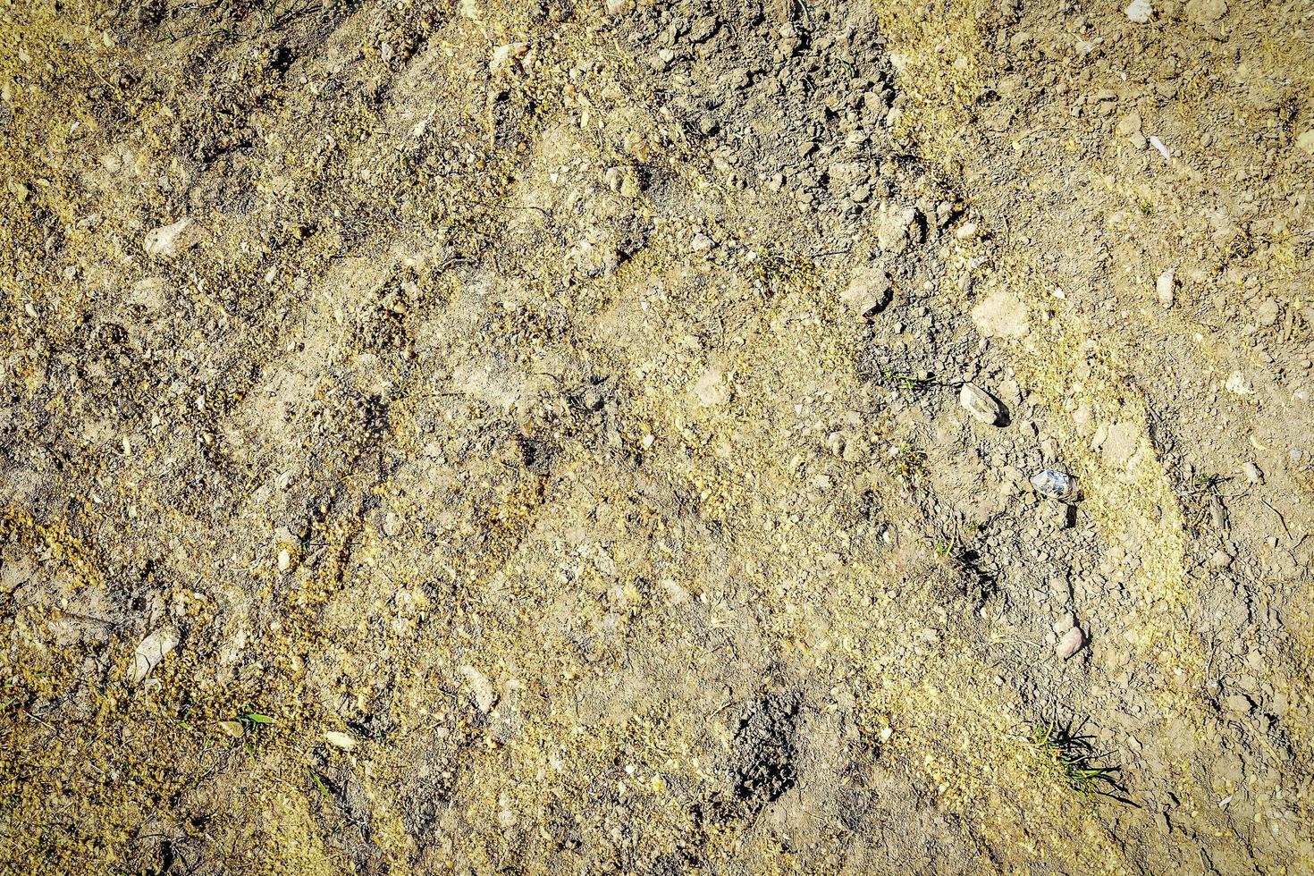 Detailed close up view on a brown sand ground texture photo