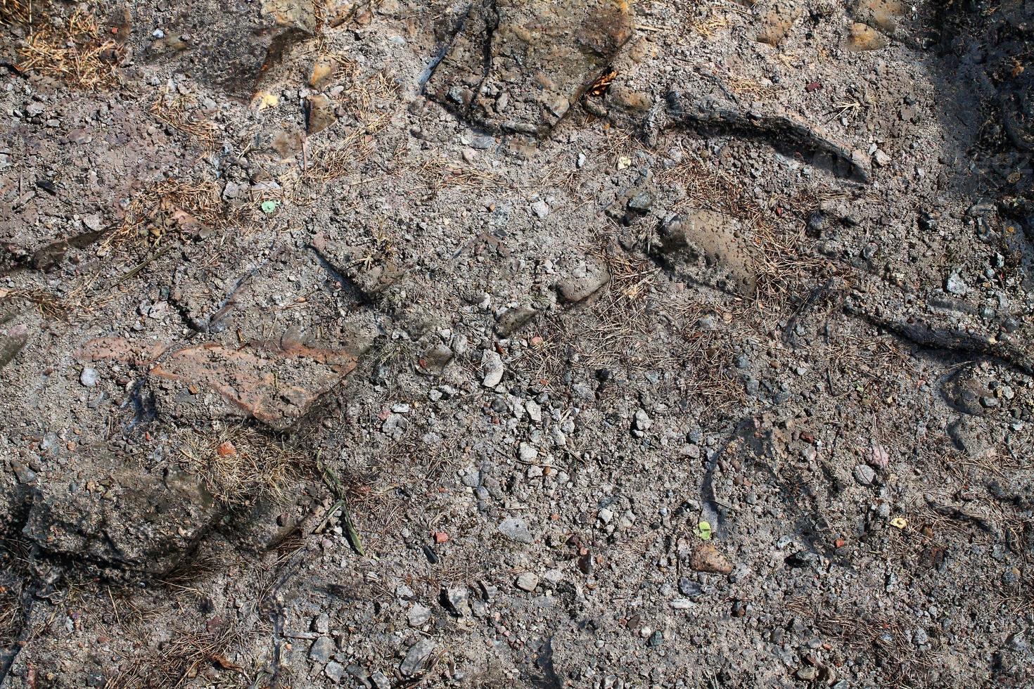 Detailed close up view on a brown sand ground texture photo