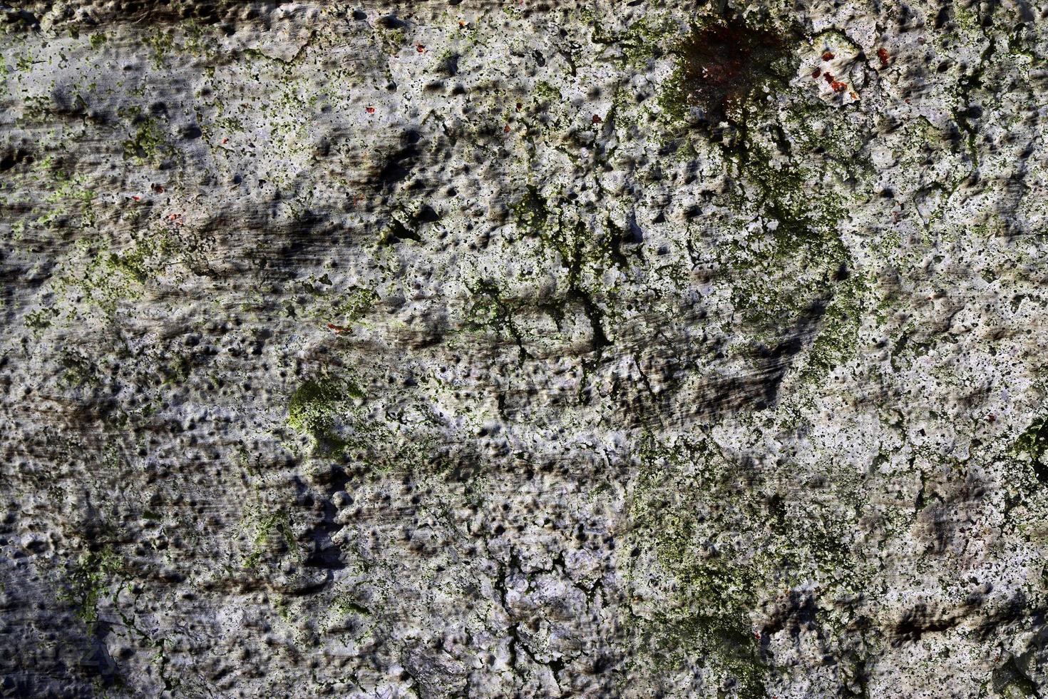 Detailed view on aged concrete walls with cracks and a lot of structure in high resolution photo