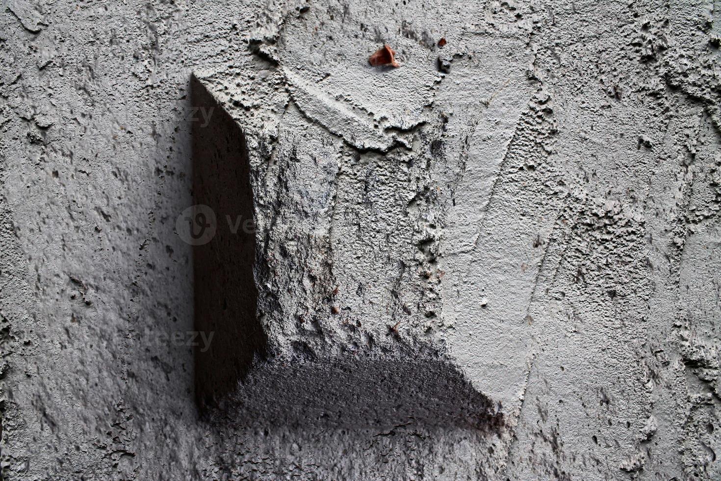 Detailed view on aged concrete walls with cracks and a lot of structure in high resolution photo