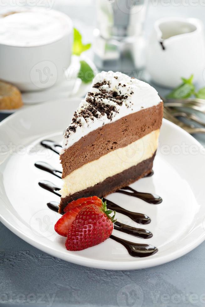 Three chocolate layered mousse cake photo