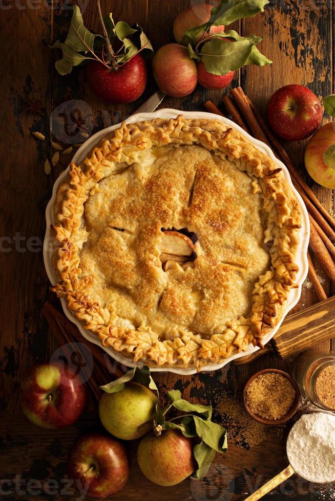 Apple pie decorated with fall leaves photo