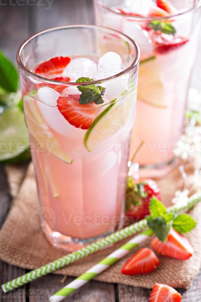 Strawberry lime lemonade in tall glasses photo