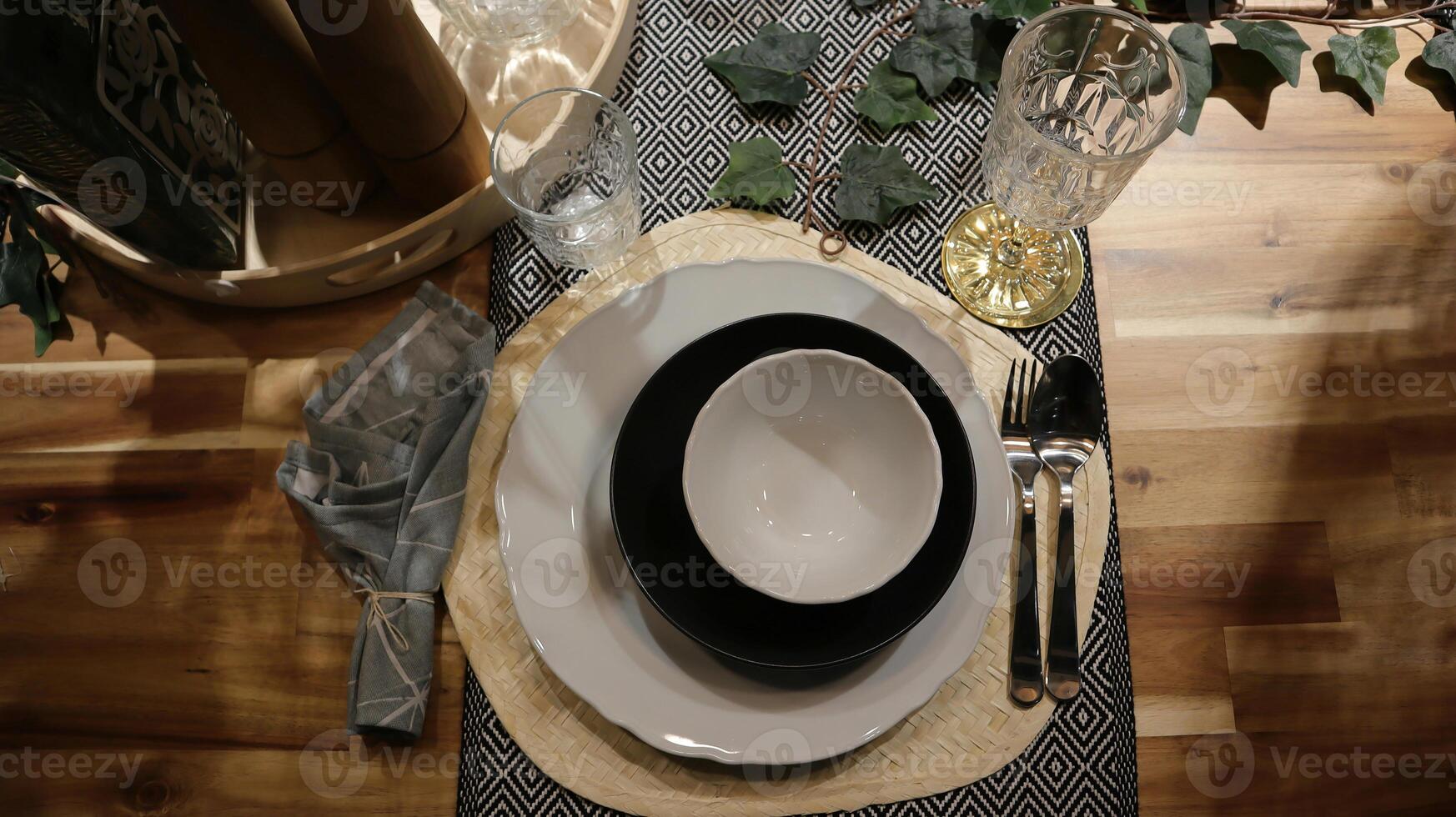 Dinning table set at home, tableware, glasses, spoon and fork. photo