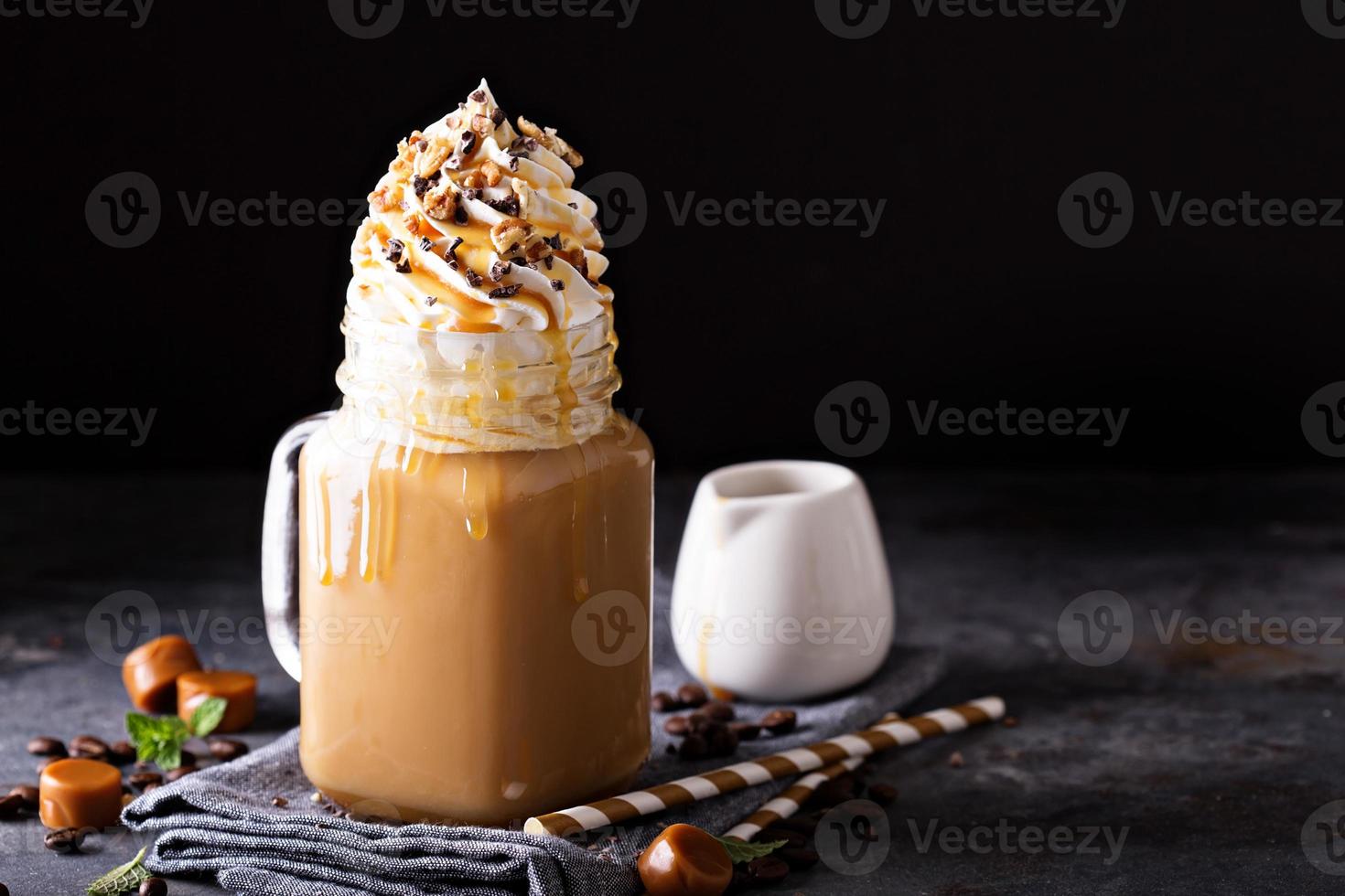 Caramel iced latte with whipped cream photo