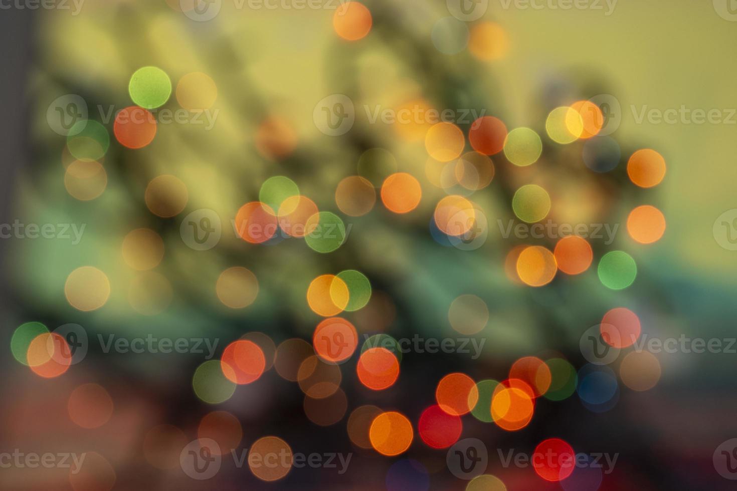 abstract defocused glowing light bulbs background, blur concept. Christmas wallpaper decorations. Festival Holiday Scenery photo