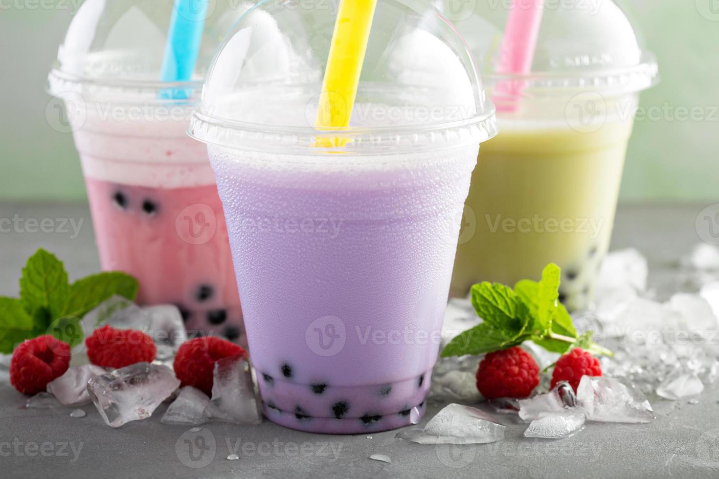 Variety of bubble tea in plastic cups photo