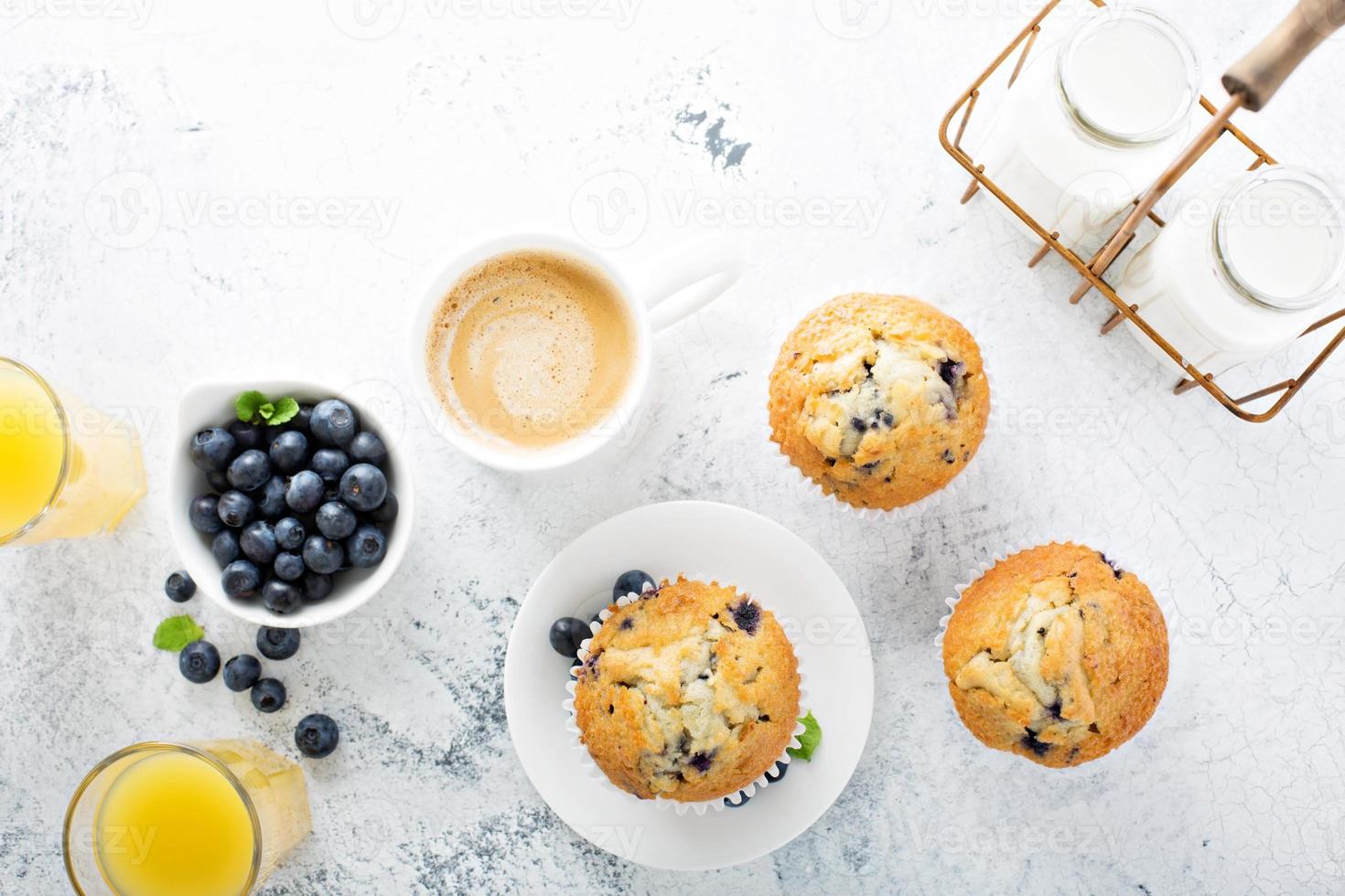 Bright and airy breakfast with blueberry muffin photo