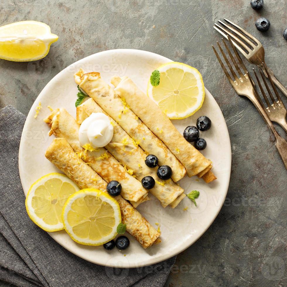 Crepes with lemon filling and blueberries photo