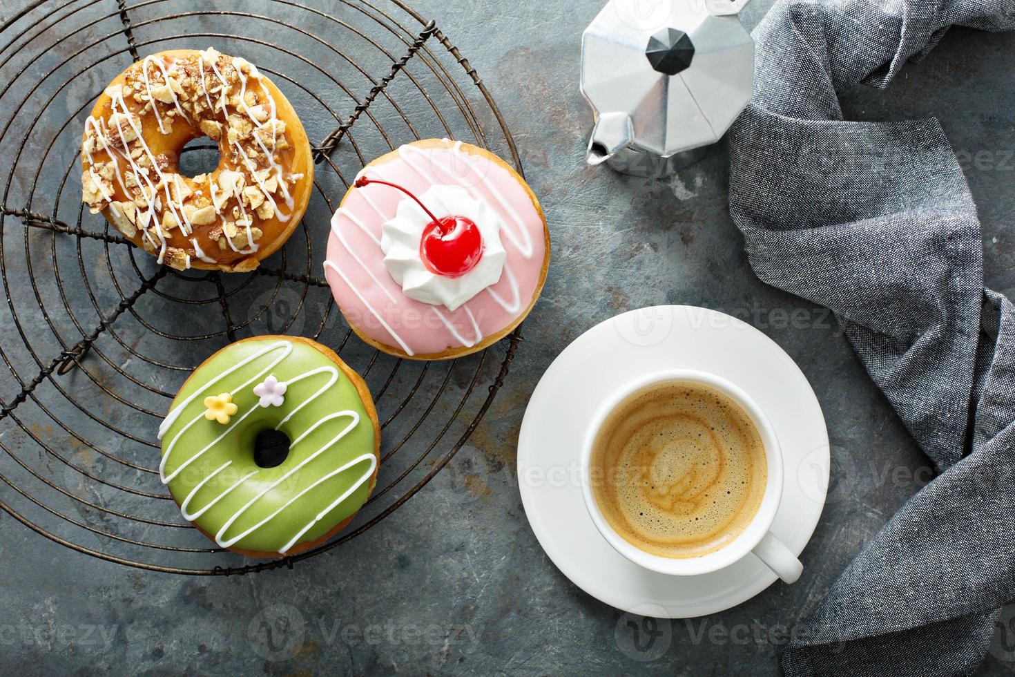 Sweet donuts with coffee overhead view photo