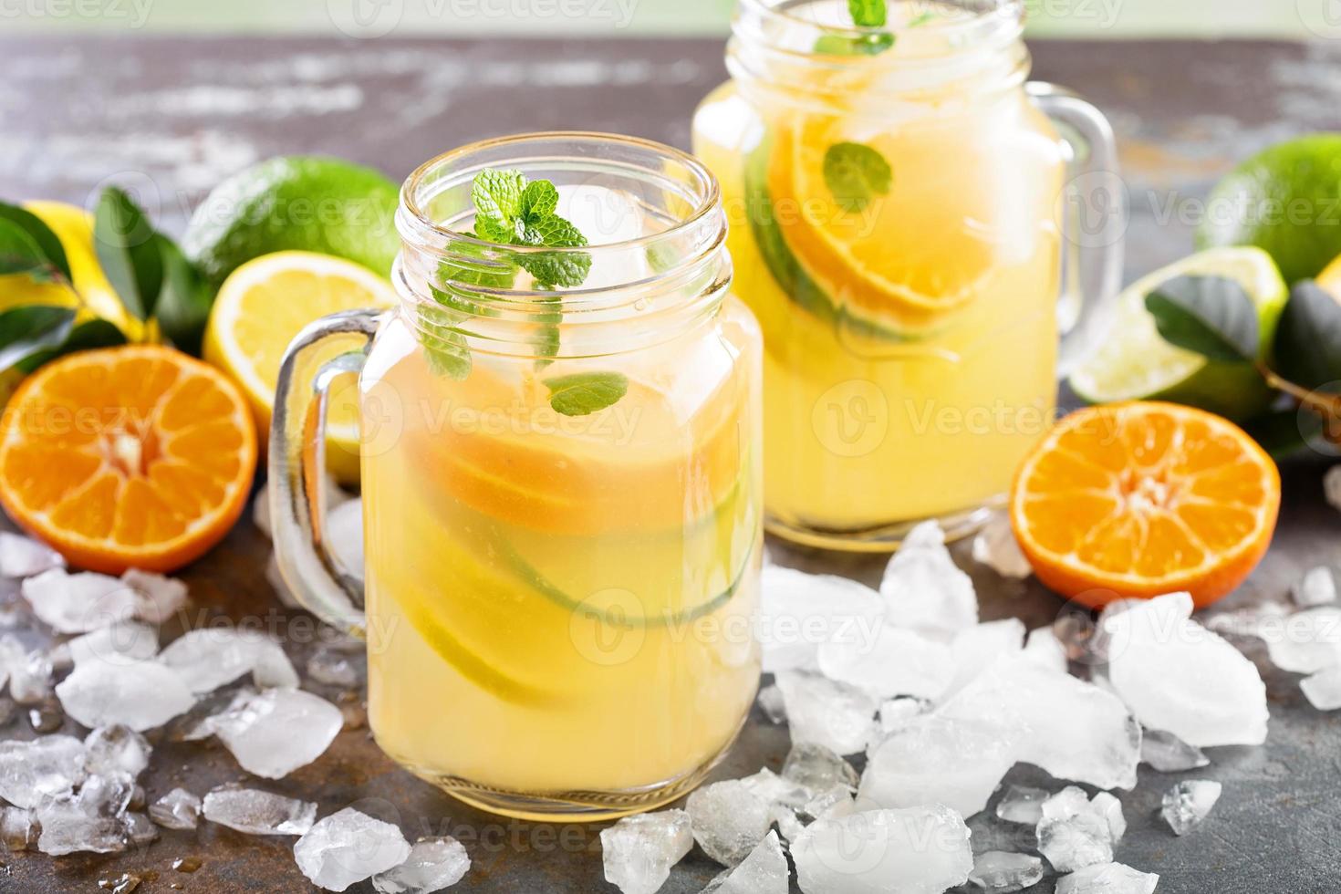 Citrus fruit lemonade in mason jars photo