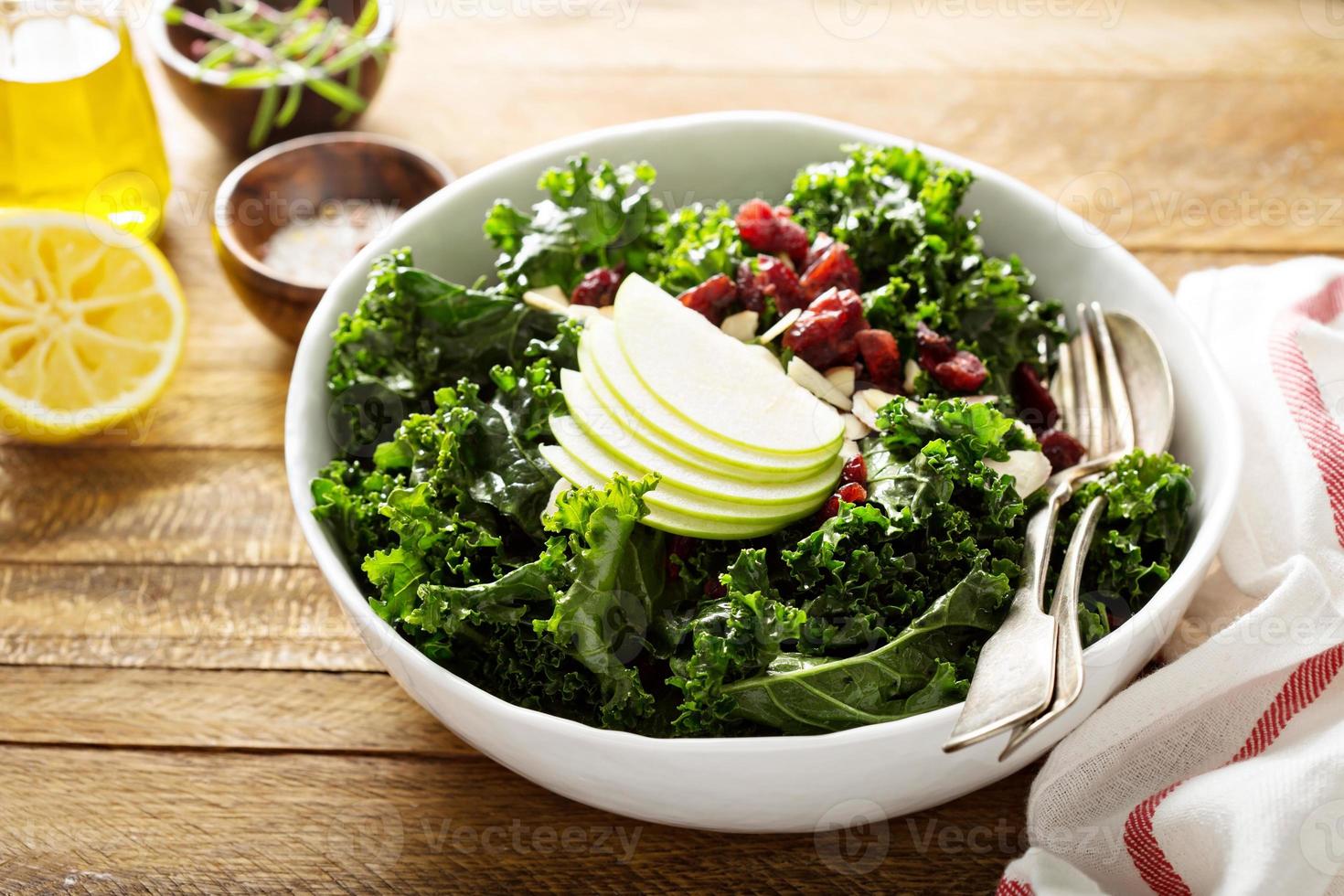 Kale salad with dried cranberry and apple photo