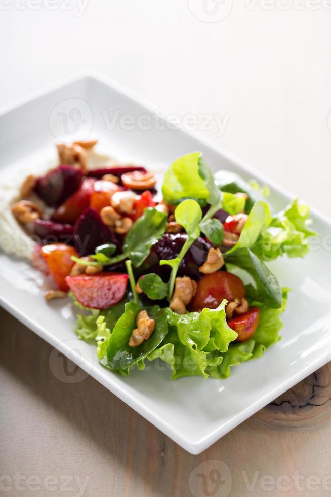 Gourmet beet salad with cheese and lettuce photo