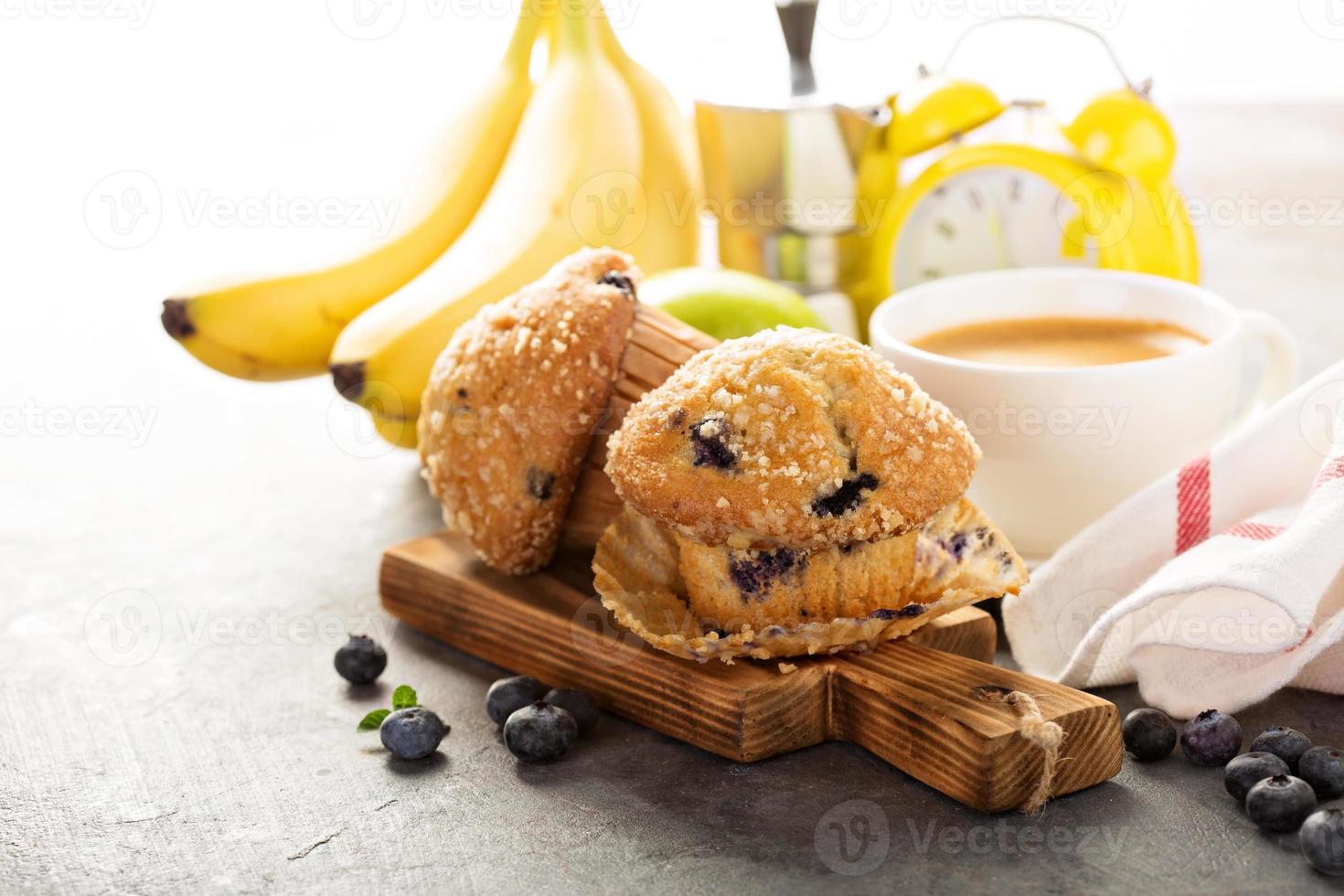 Blueberry and banana muffins with coffee for breakfast photo