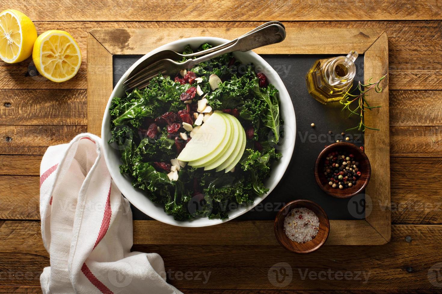 Kale salad with dried cranberry and apple photo