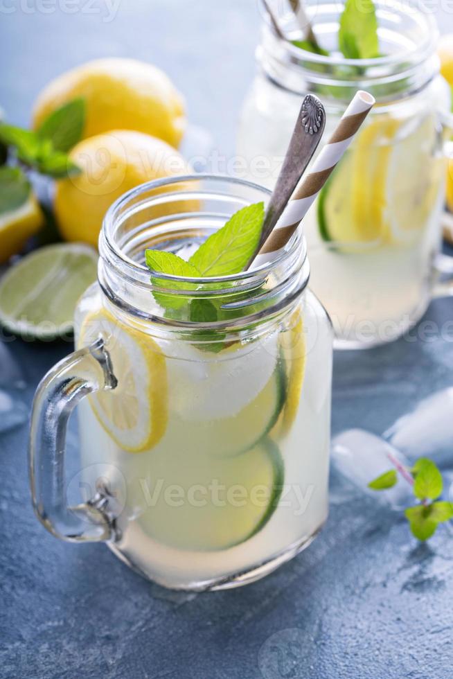 Fresh citrus lemonade in mason jars photo