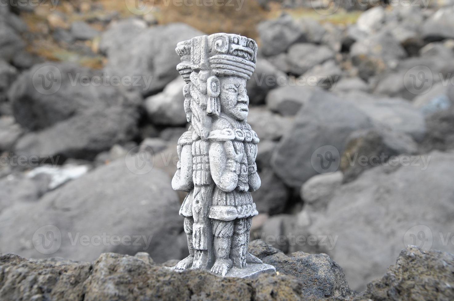 Pre-columbian miniature on the rocks photo