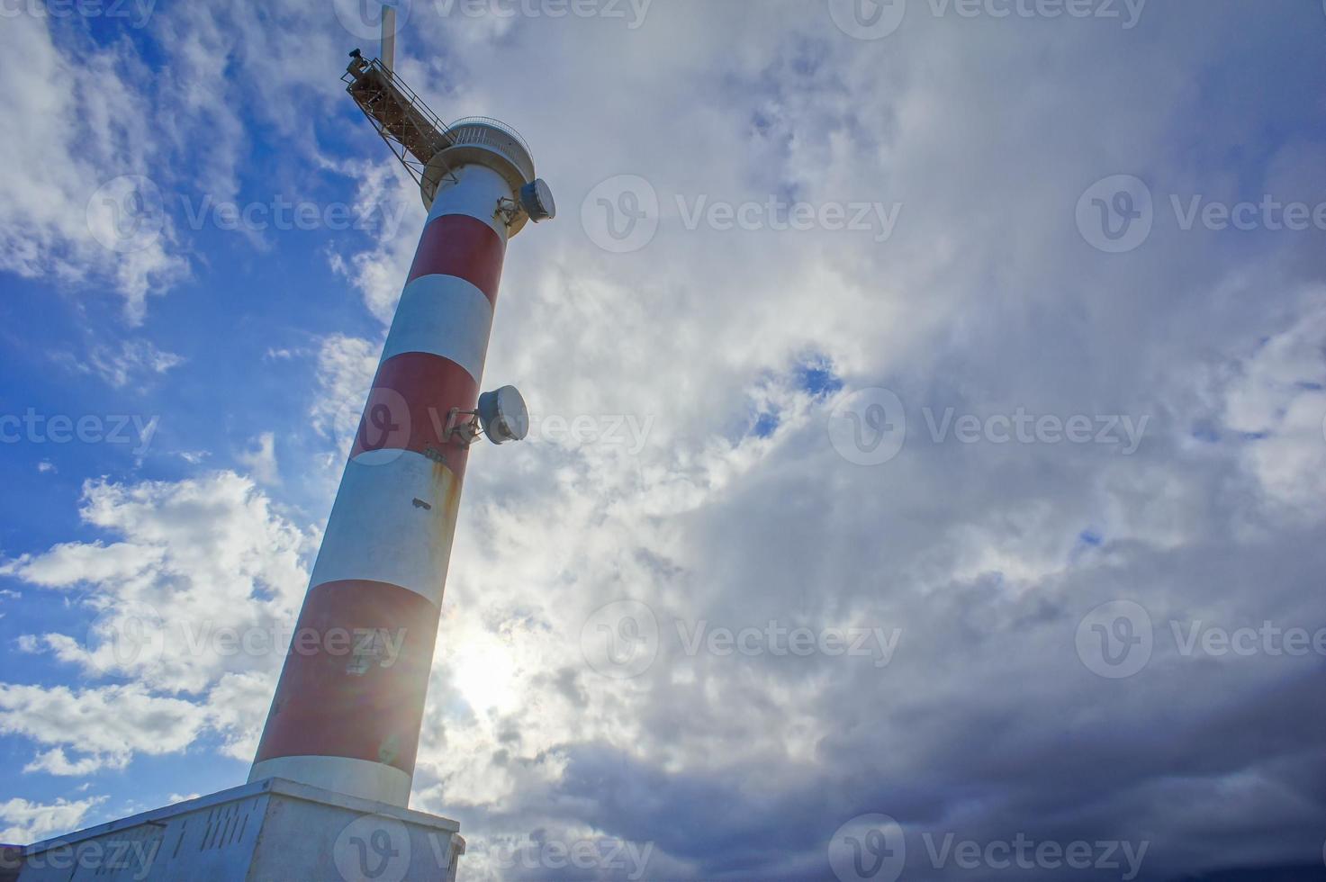 Lighthouse by the sea photo