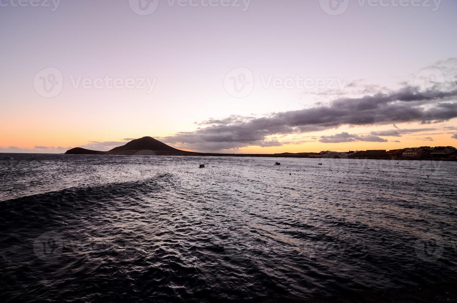 Sunset over the ocean photo