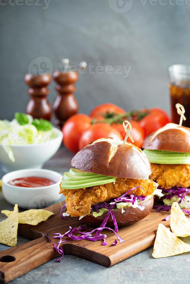 Chicken tender sandwich with avocado and slaw photo