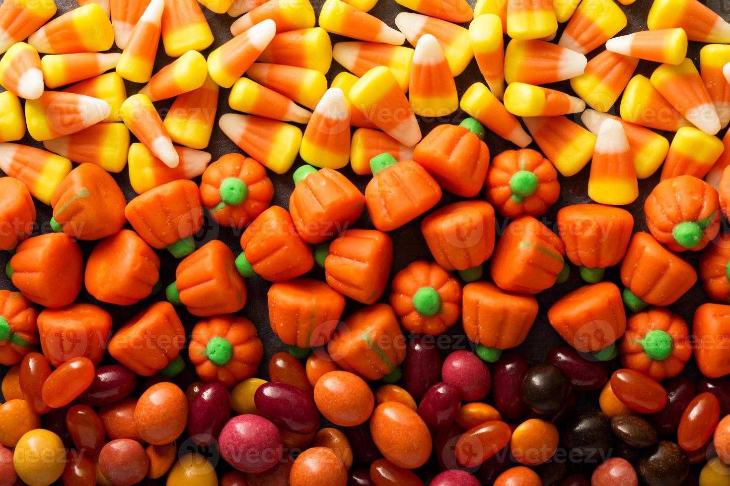 Candy corn and pumpkin Halloween background photo