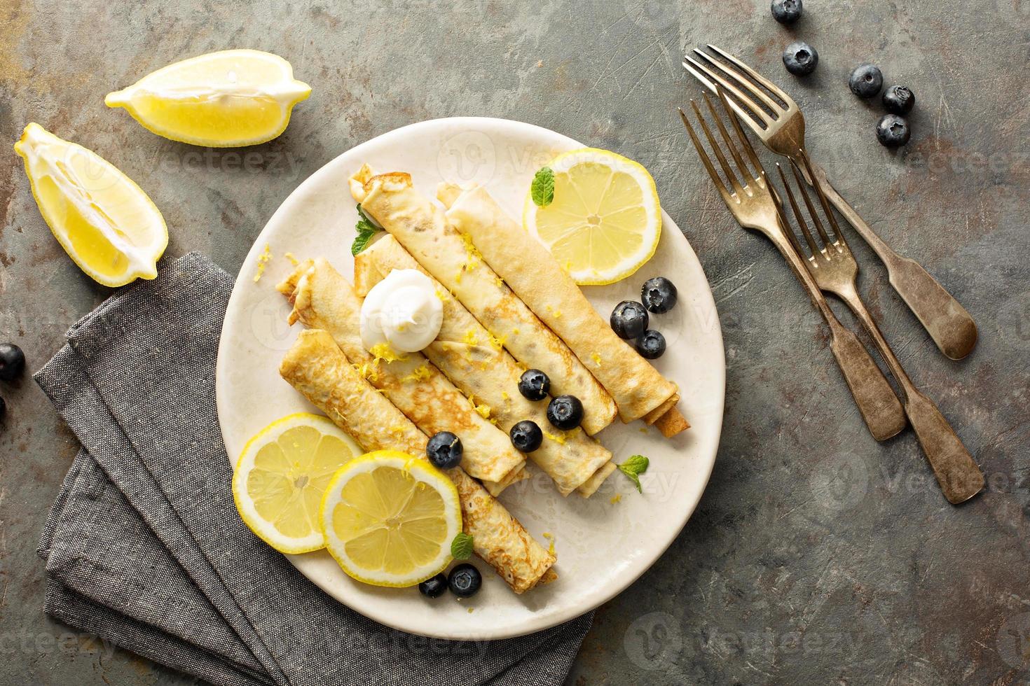 Crepes with lemon filling and blueberries photo