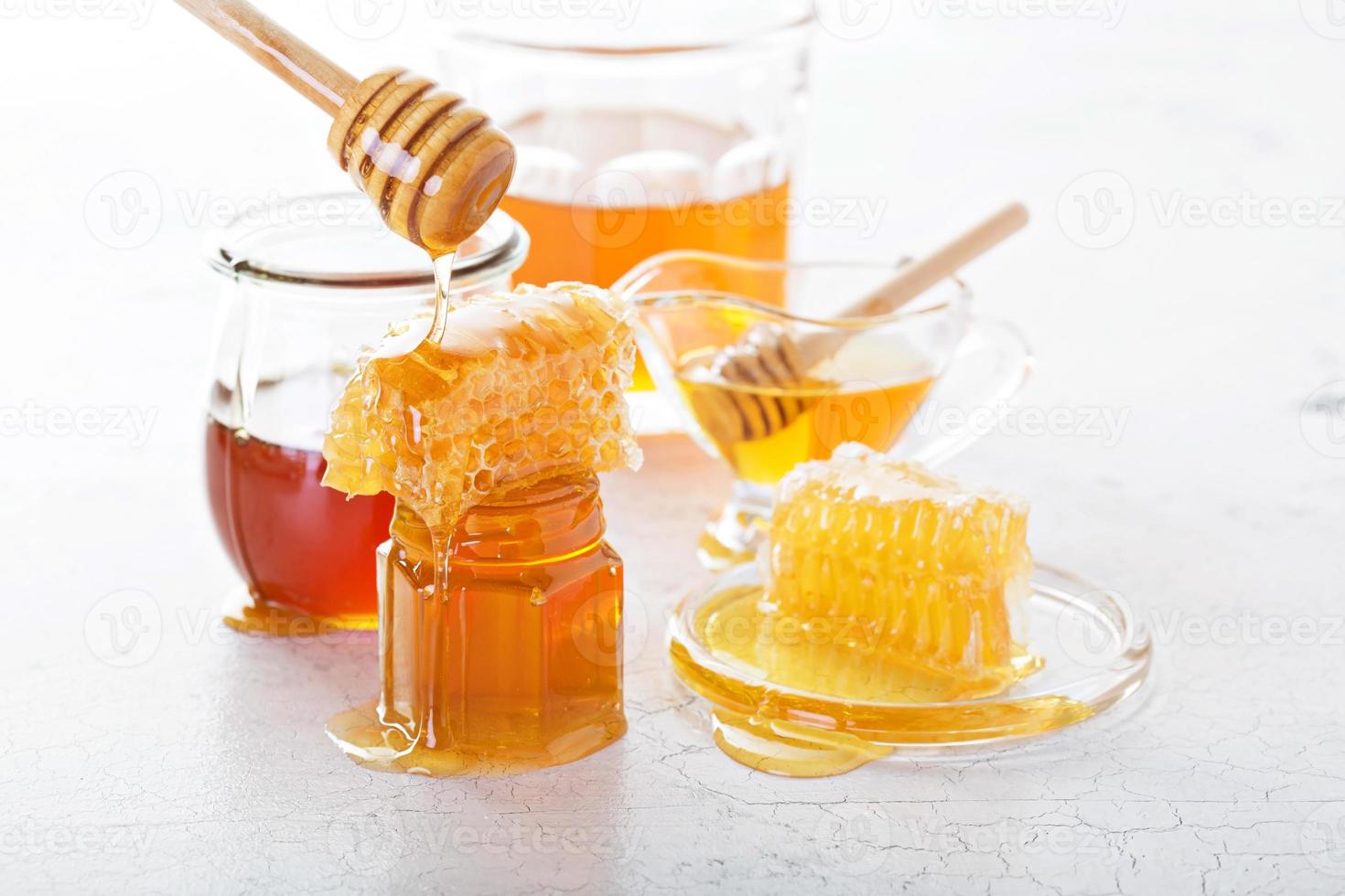 Various types of honey and honeycomb photo