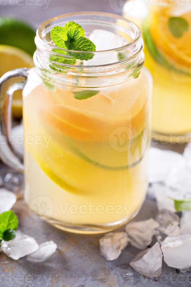 Citrus fruit lemonade in mason jars photo