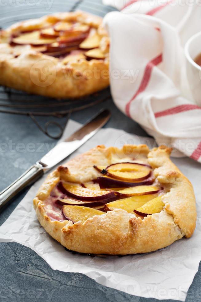 Open pie with plums photo