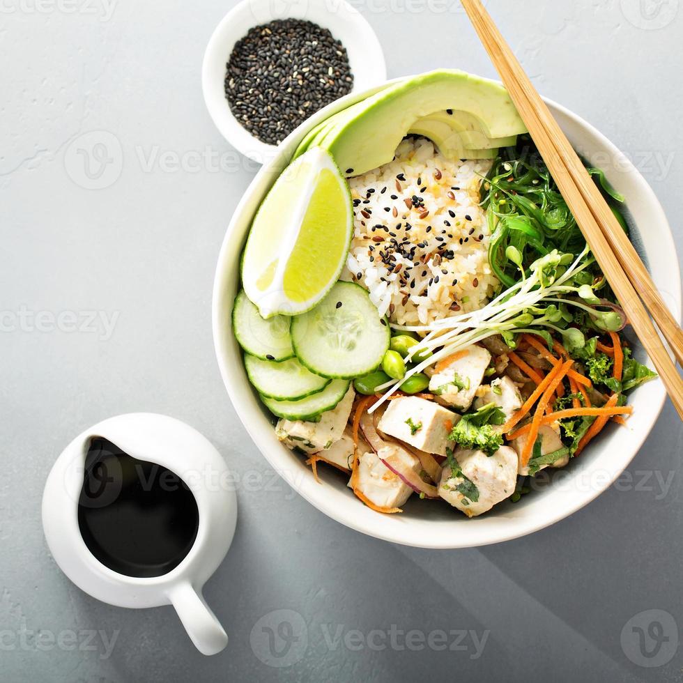 Poke bowl with silken tofu, rice and vegetables photo