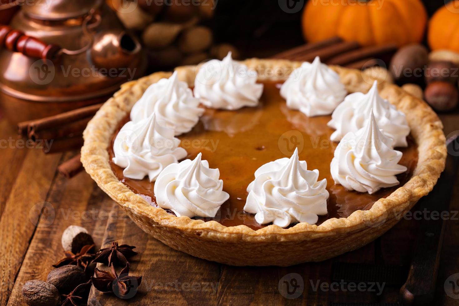 Pumpkin pie with whipped cream photo