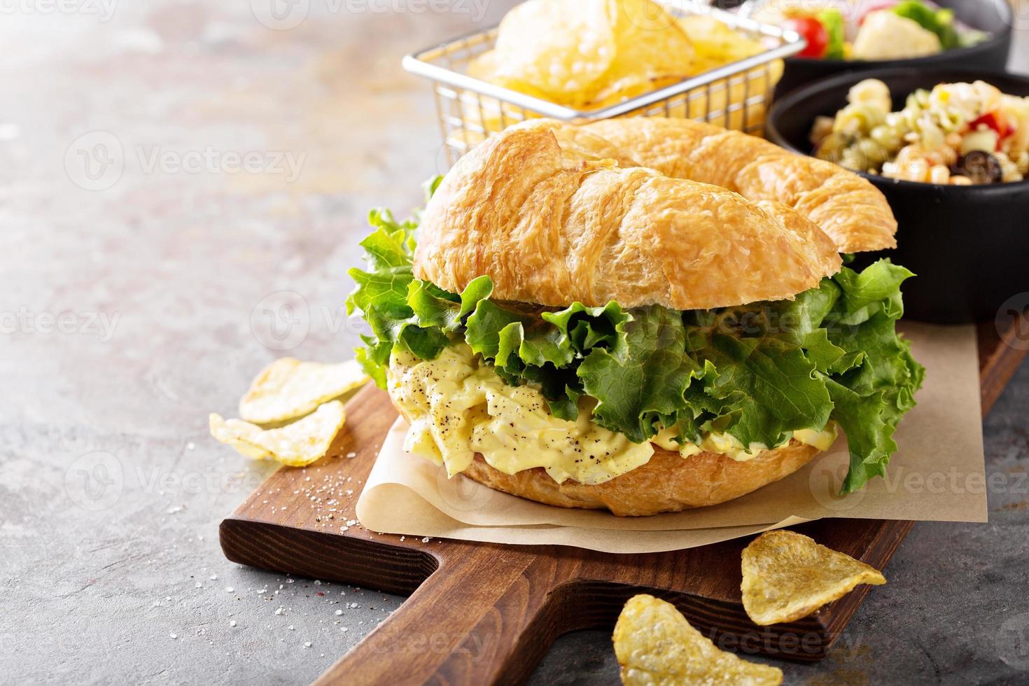 Egg salad sandwich on croissant photo