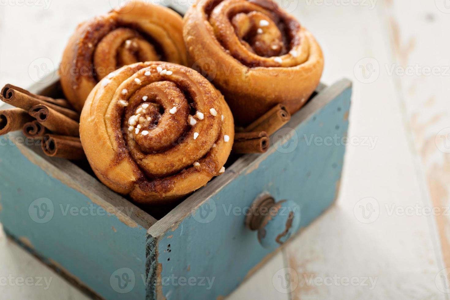 Cinnamon buns in a wooden box photo